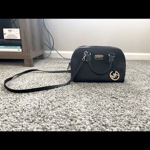 Micheal Kors bag! I loveeeee this bag very stylish & goes with everything!